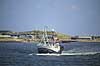 Fiskekutter. En fiskekutter stevner ud af havnen i Hvidesande  Vesterhavet / Hvidesande Danmark   Fiskeri, erhvervsfiskeri